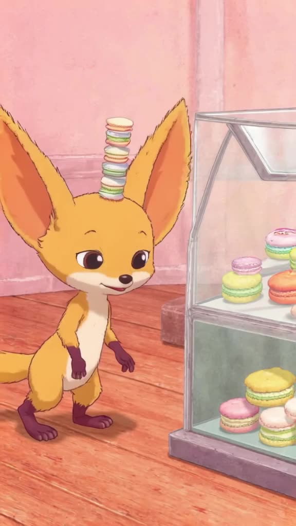 A fennec fox with enormous ears balances a tower of three tiny macarons on its head while…