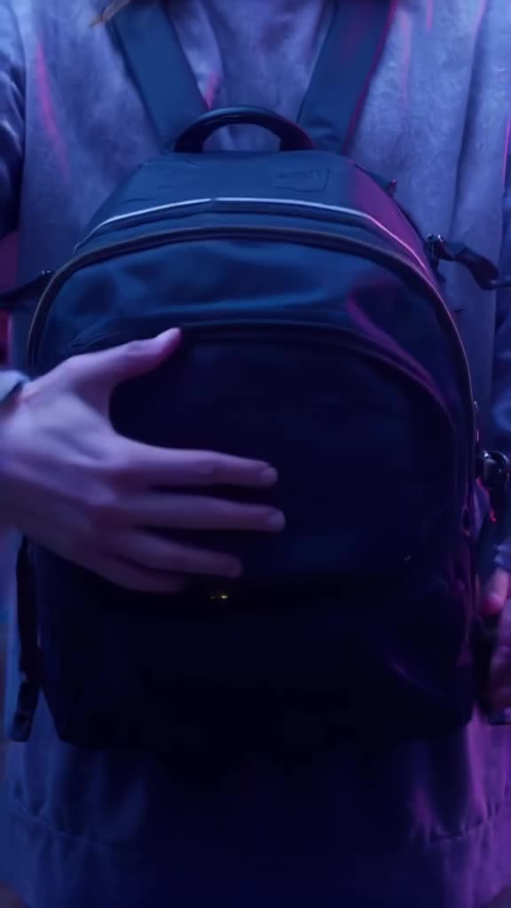 A streetwear backpack unzips to reveal a universe of floating miniature cities inside its…