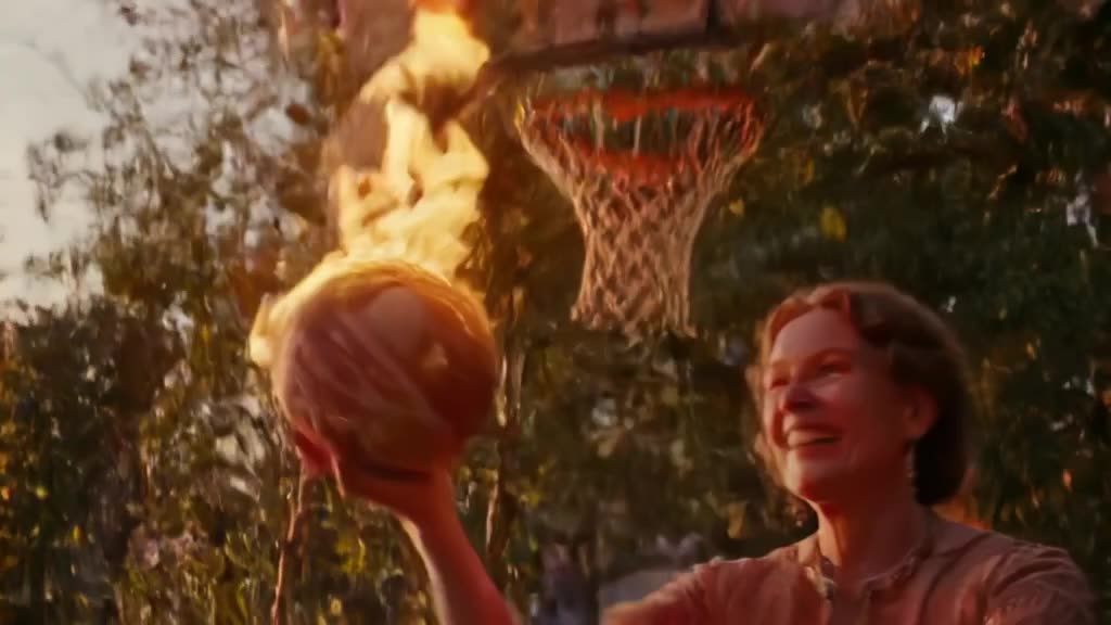 A grandma in a vintage dress plays basketball, dunking a ball made of fire into a hoop of…