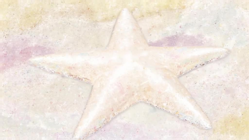 A starfish lies still on the sand. It turns over to reveal a cute, sleeping puppy face un…