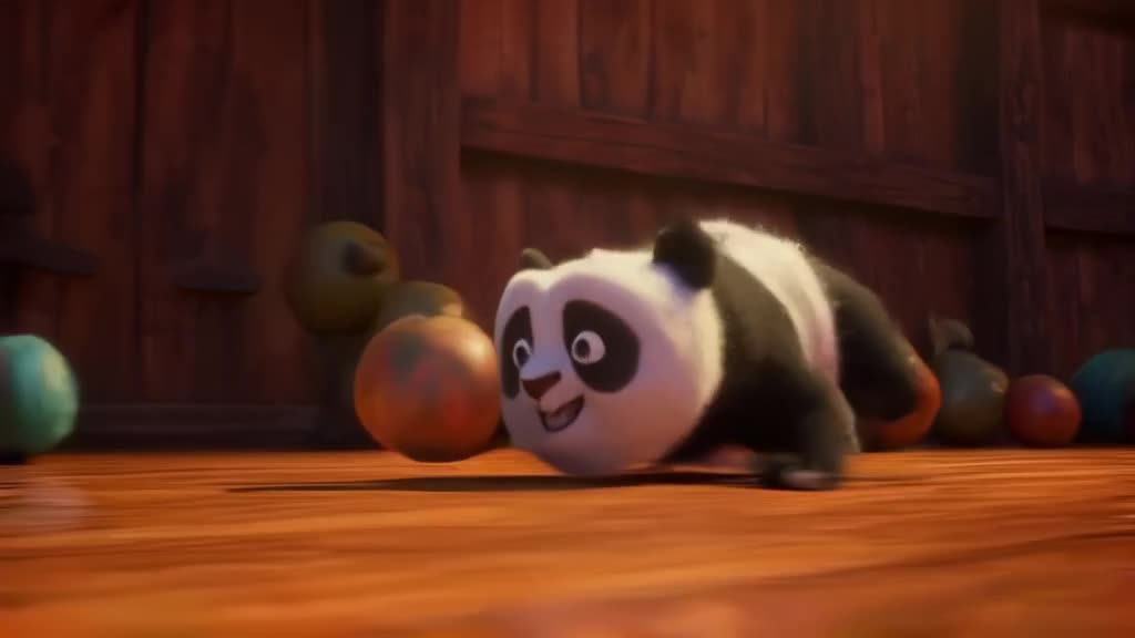 A panda cub slides on its belly across a polished wooden court, stealing the ball. It loo…