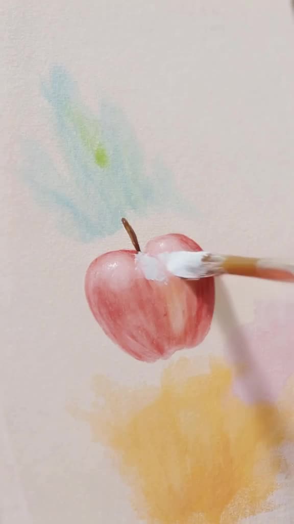 A painter’s brush strokes paint a 3D apple into existence on a canvas, which then rolls o…