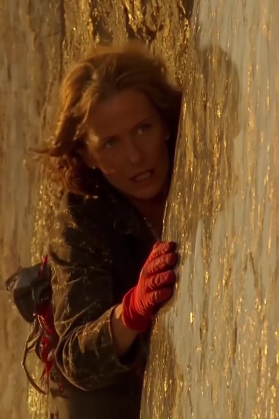 A vintage 1950s style grandma rock climbing a sheer glass cliff, her red gloves gripping …