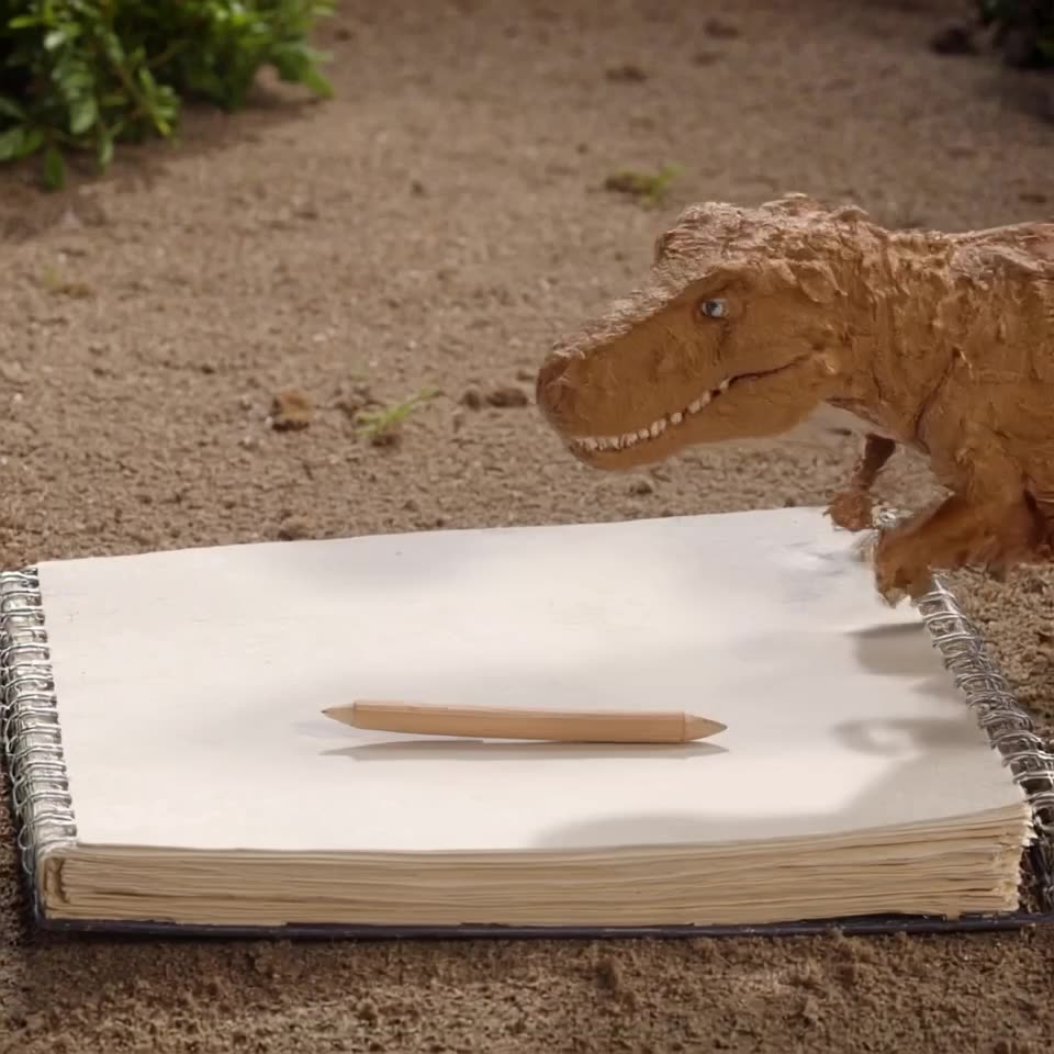 A sketch of a T-Rawr on notebook paper begins to lift off the page in 3D clay texture. It…