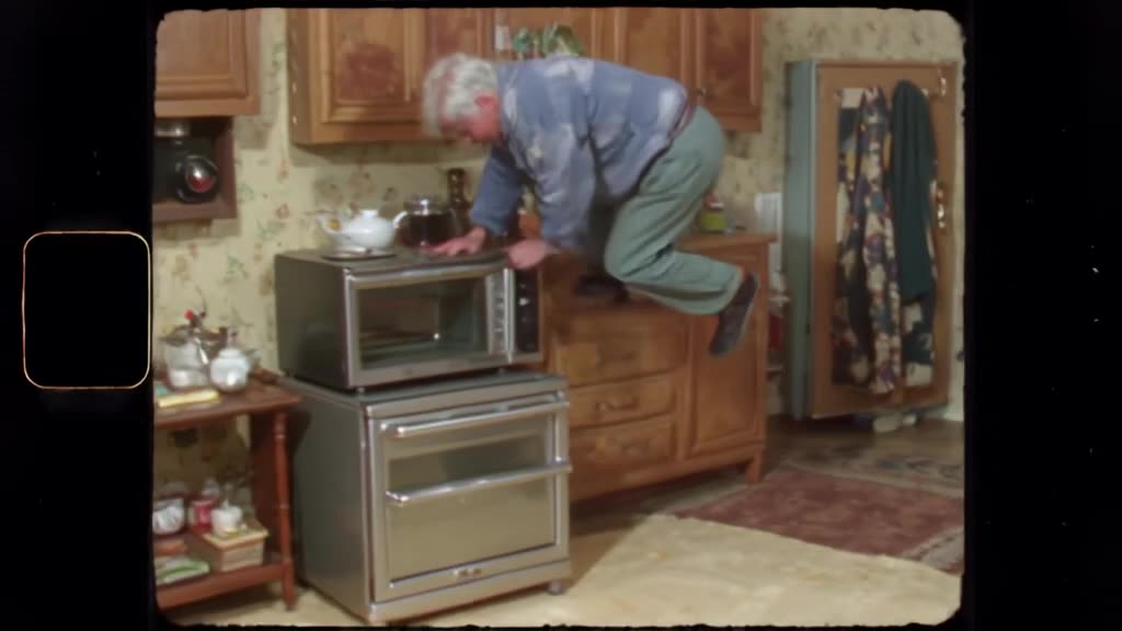 VHS style tape of a grandpa doing backflips off a toaster oven. Grainy filter, tracking l…