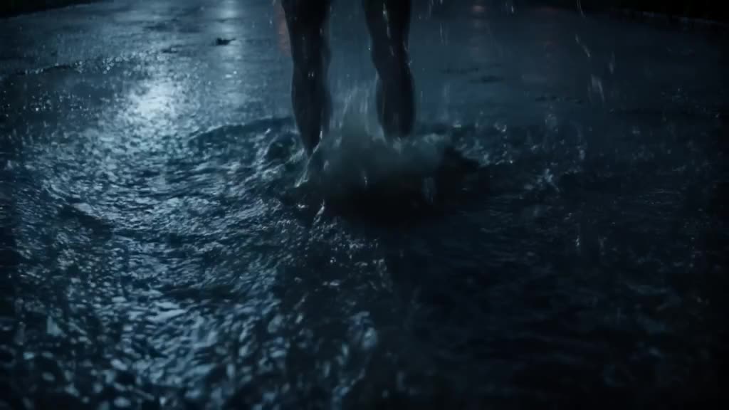 A zombie with translucent skin stands in rain. Raindrops hit a puddle, creating perfect c…