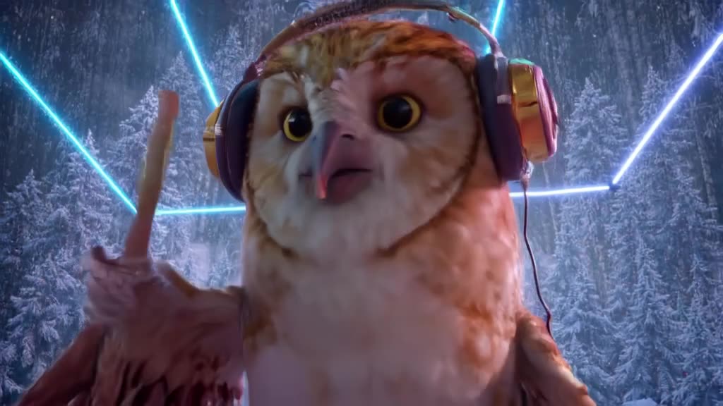 An owl wearing oversized headphones taps its beak rhythmically to a heavy trap beat. Snow…