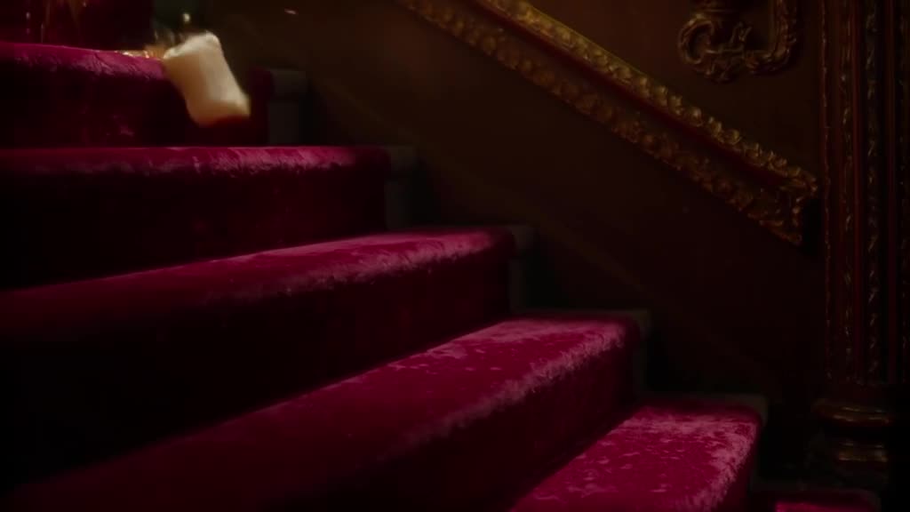 A single grape rolls down a velvet velvet staircase in slow motion, bursting into juice u…