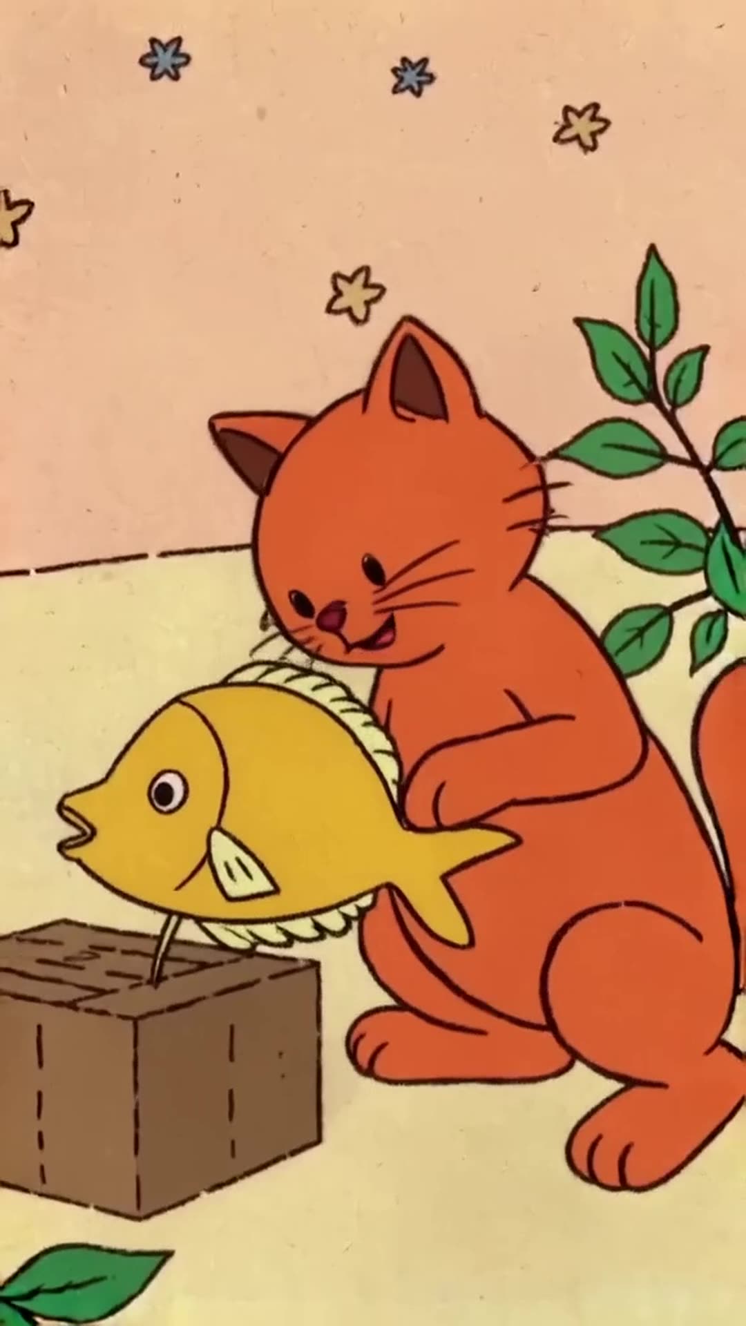 orange cat is playing with the golden fish