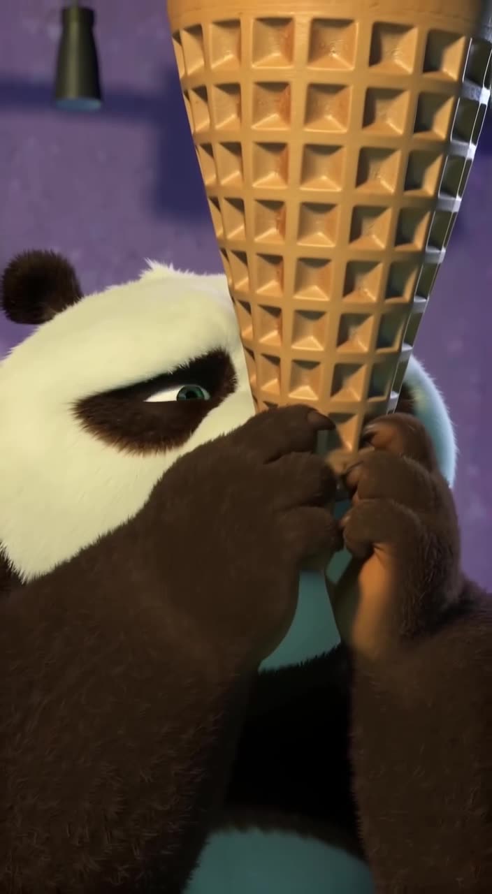A panda bear attempts to balance a towering waffle cone on its nose. It wobbles precariou…