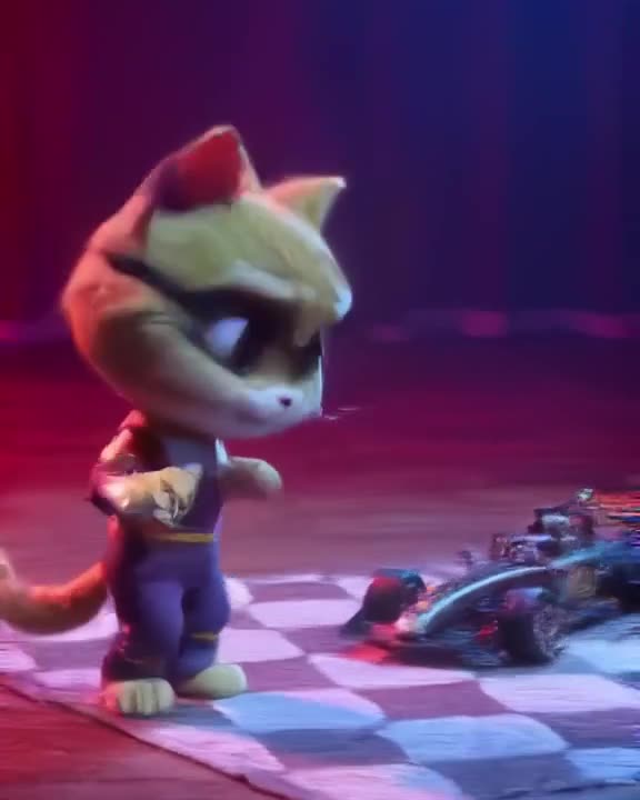A calico cat in a tiny racing suit stands beside a miniature F1 car. As a cucumber approa…