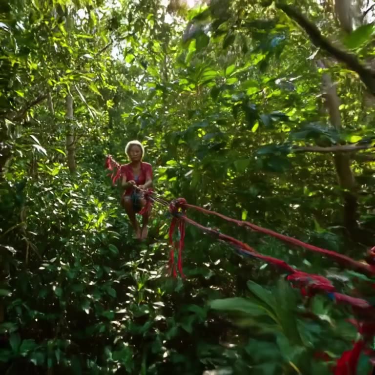 An elderly woman zip-lining over a lush jungle canopy, her rope made of colorful ribbons.…